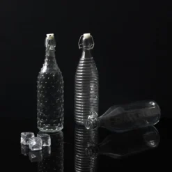 BOUTEILLE EN VERRE A CLAPET EMBOSSE 1L