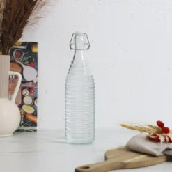 BOUTEILLE EN VERRE A CLAPET EMBOSSE 1L